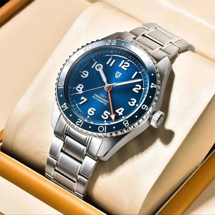 Silver watch with blue dial on a beige cushion