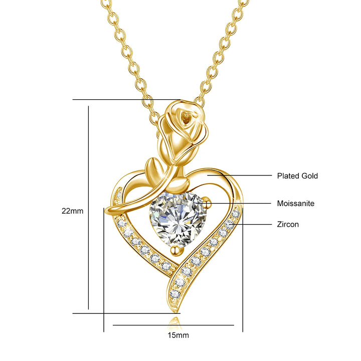 Gold pendant with heart design and gemstones, labeled with materials and dimensions.