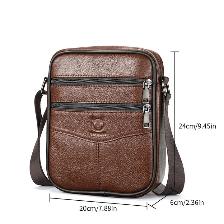 Brown leather crossbody bag with measurements and Bull Captain branding on a white background