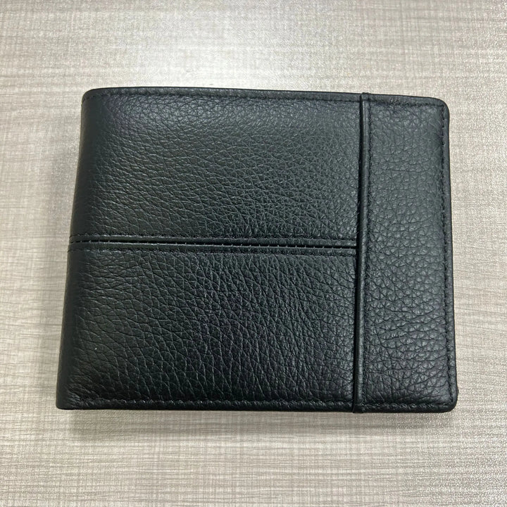 Black leather wallet on a textured gray surface