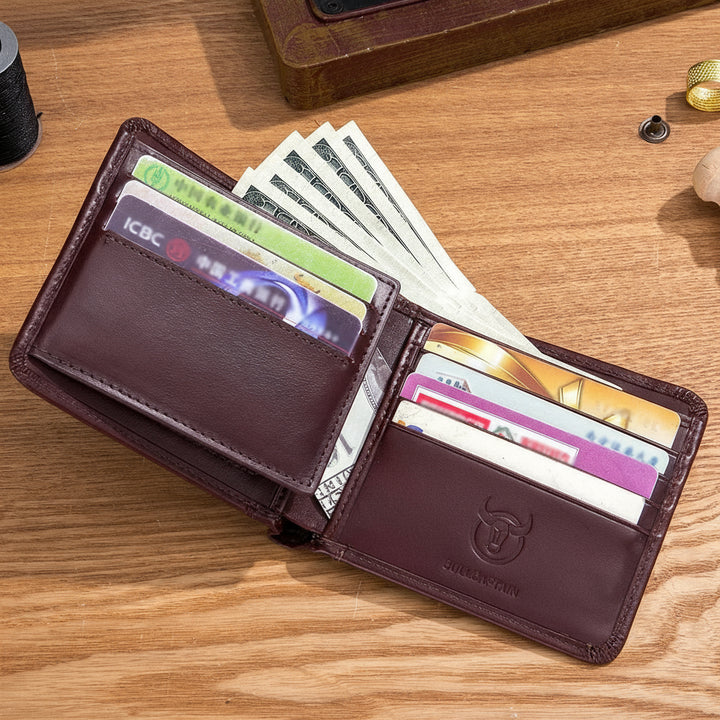 Brown leather wallet with cards on a wooden surface, featuring the Bullcaptain brand.