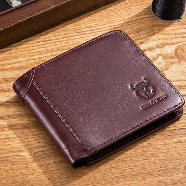 Brown leather wallet with a brand logo on a wooden surface