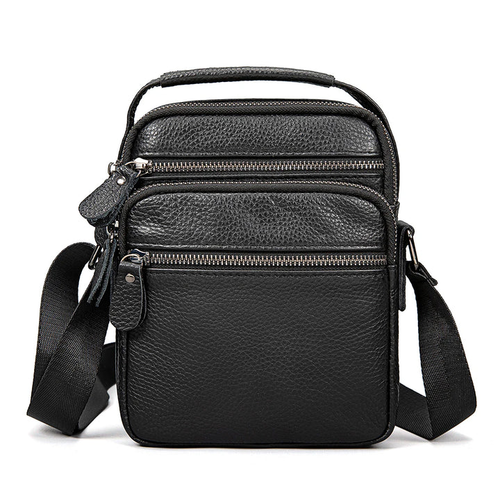 Black leather crossbody bag with multiple pockets on a white background